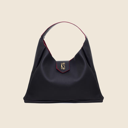 Bolsa Veneza preto com vinho em fundo bege